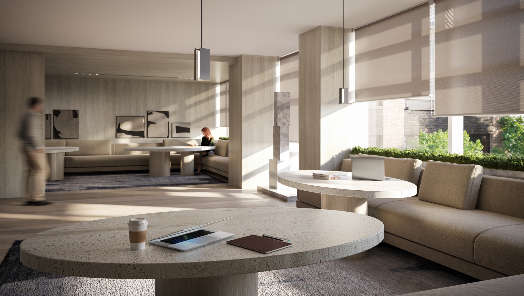 Co-working pavilion with stone tables and light wood paneling